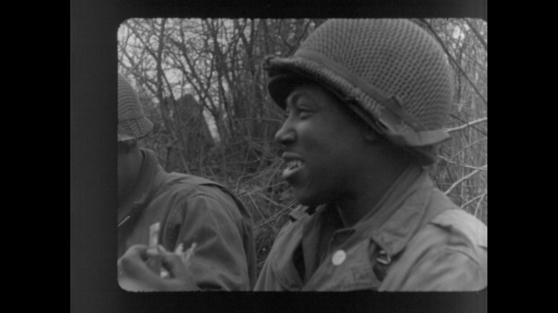 a frame taken from the clip showing soldiers of the 614th Tank Destroyer Battalion eating chow.