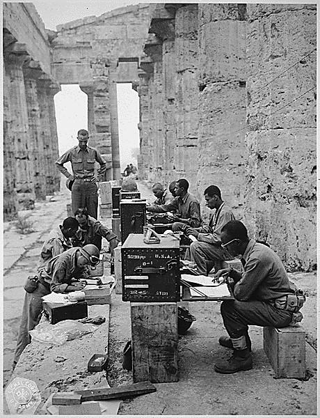 Photograph of Members of the Headquarters Company, 480th Port Battalion Set Up Between the Columns of the Ancient Greek Temple of Neptune. Although this location is in Paestum, Sicily, I too have seen many Ancient Greek monuments.