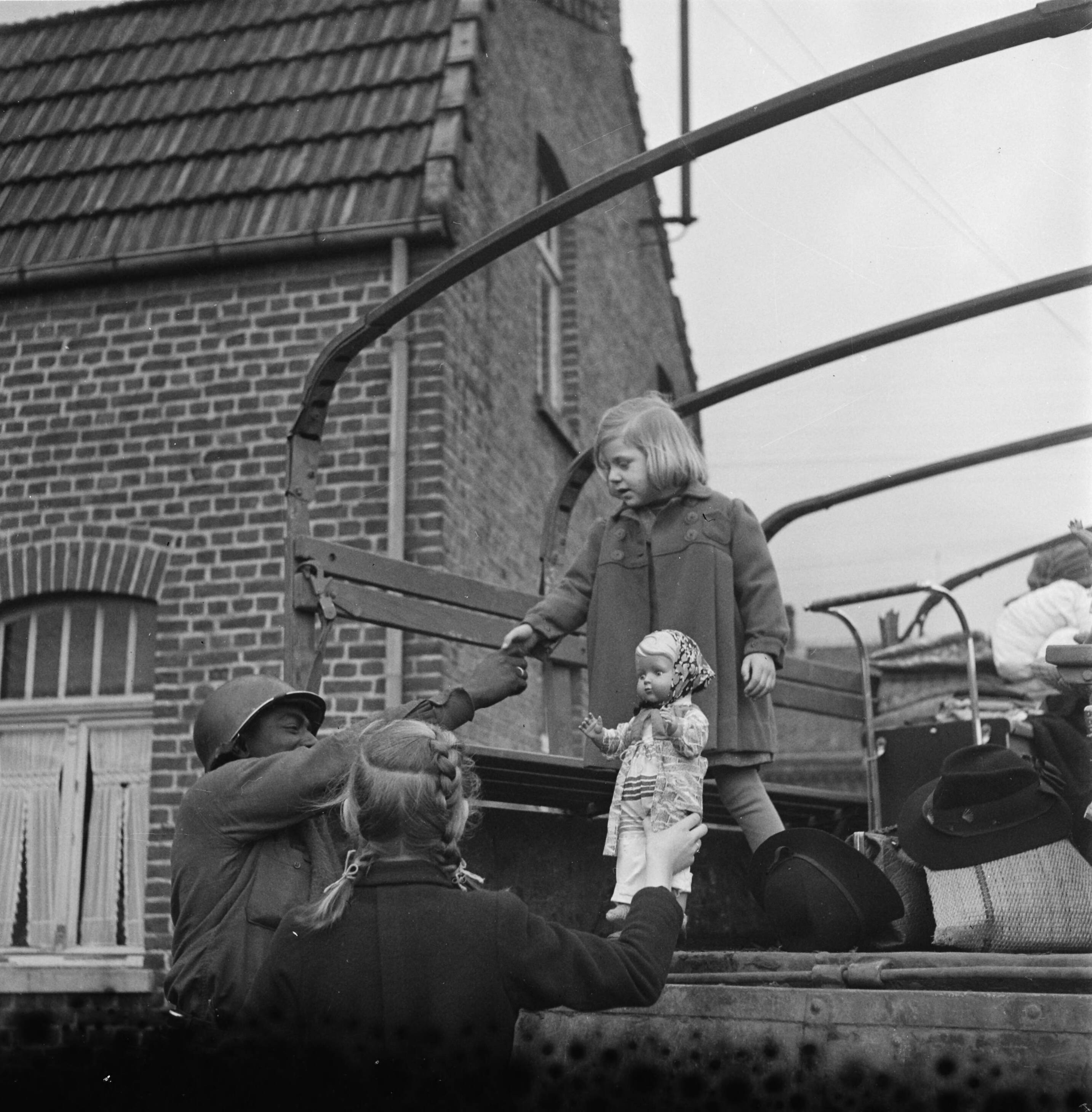 Historical image showing 3454th Quartermaster Truck Company of Black American soldiers during WWII