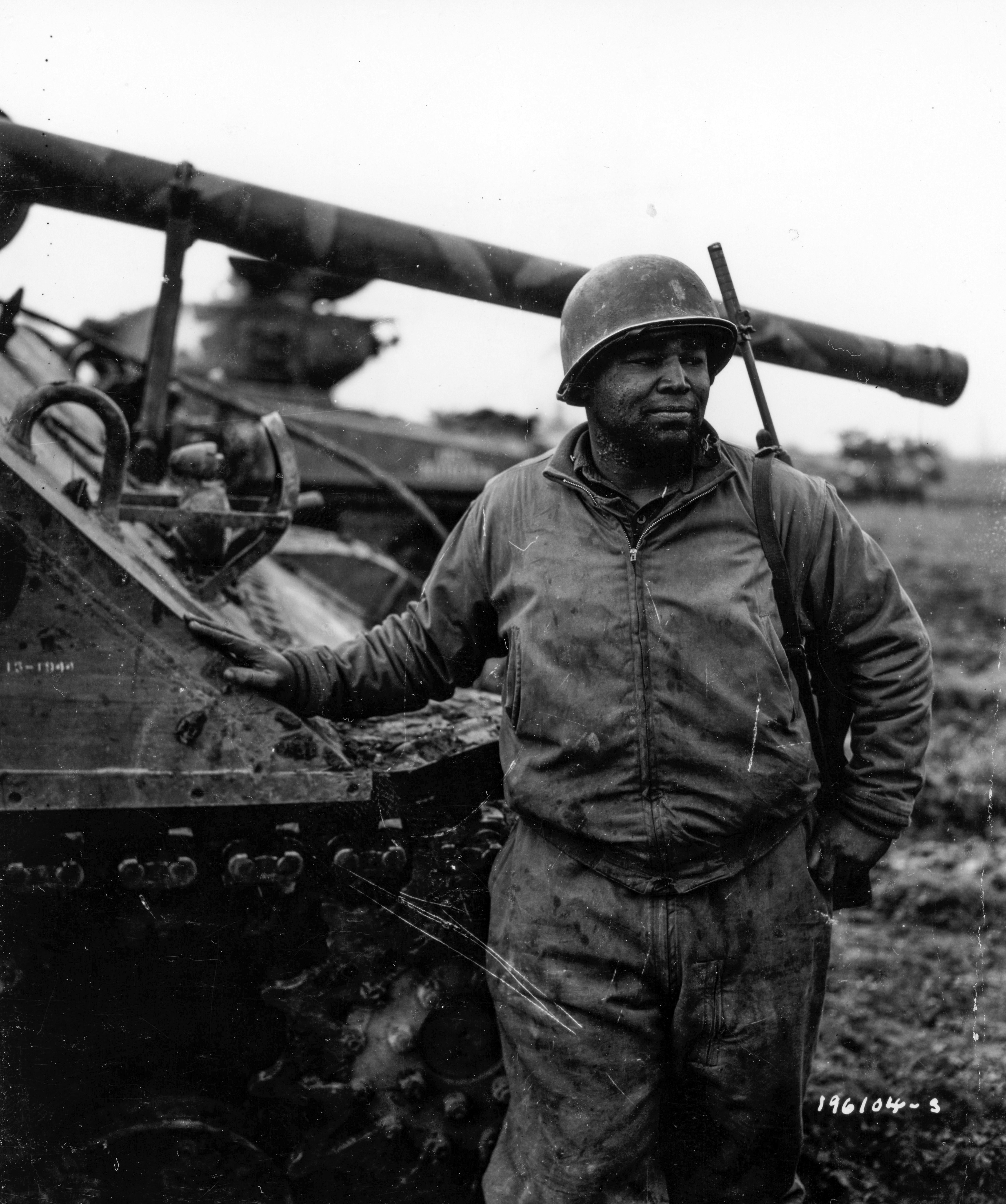 Historical image showing 2nd Lt. Joe E. Johnson, New York City, is a maintenance officer of a Motor Transport unit awaiting action near Nancy, France. of Black American soldiers during WWII