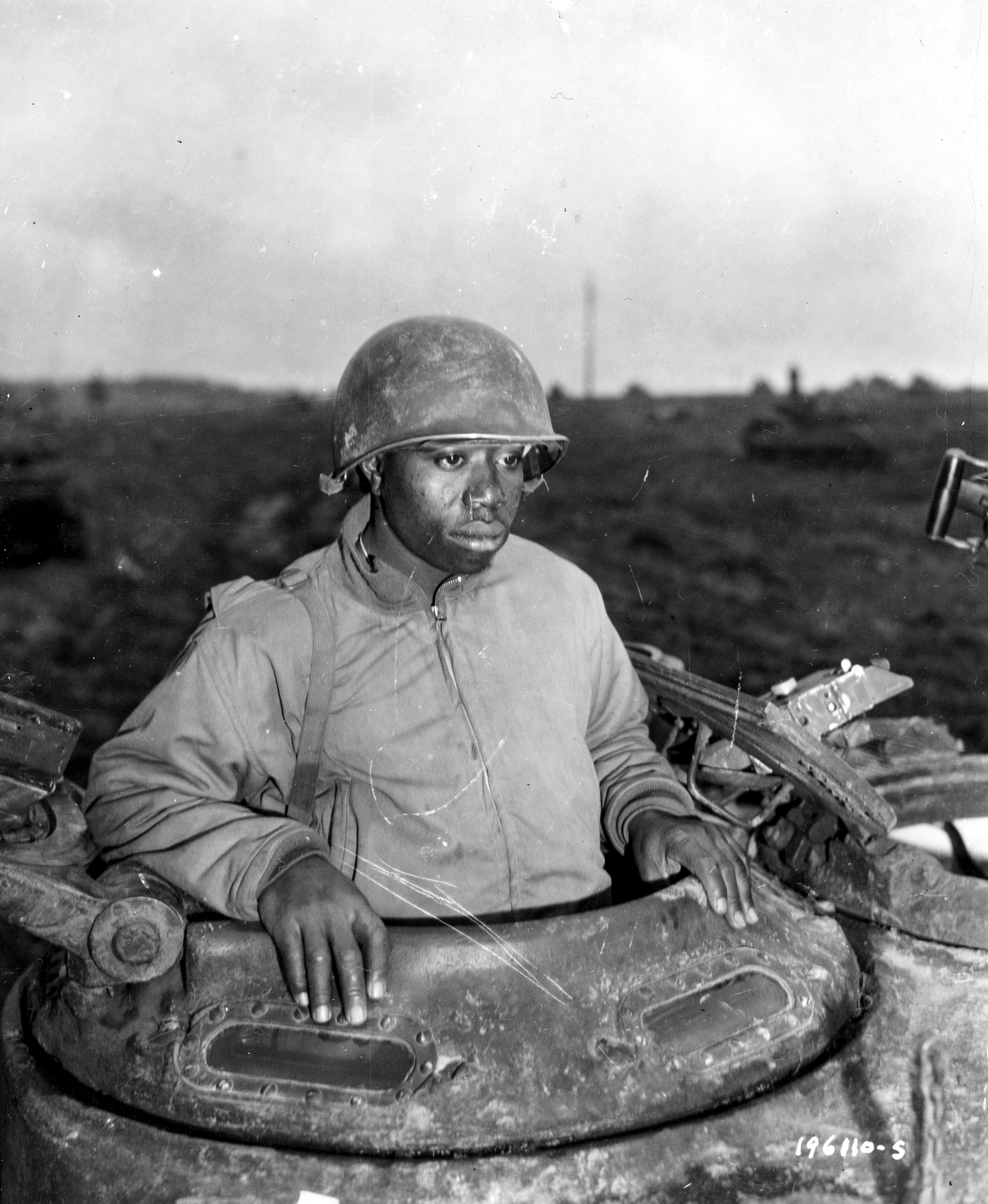 Historical image showing Sgt. Harvey Woodward, Howard, Ga., is a commander of an M-4 tank, somewhere in France. of Black American soldiers during WWII
