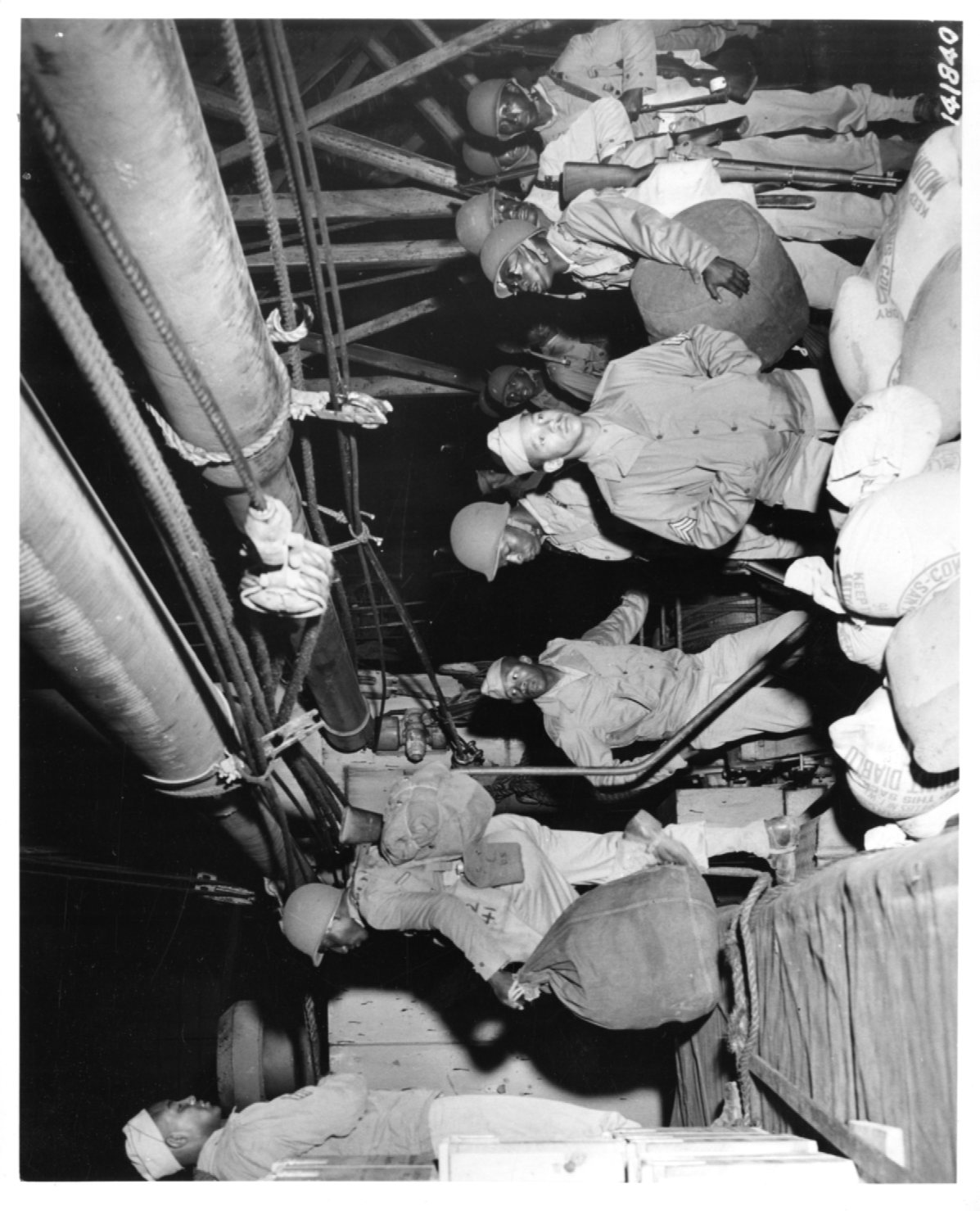 Historical image showing Soldiers of the 76th Coast Artillery on board of the SS Mormacsea of Black American soldiers during WWII