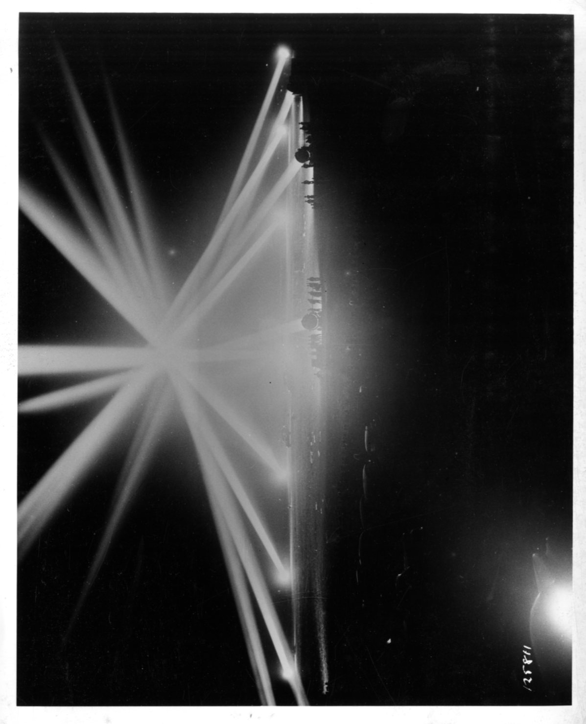 Historical image showing Soldiers of Battery E the 76th Coast Artillery are lighting up the field during exercises of Black American soldiers during WWII