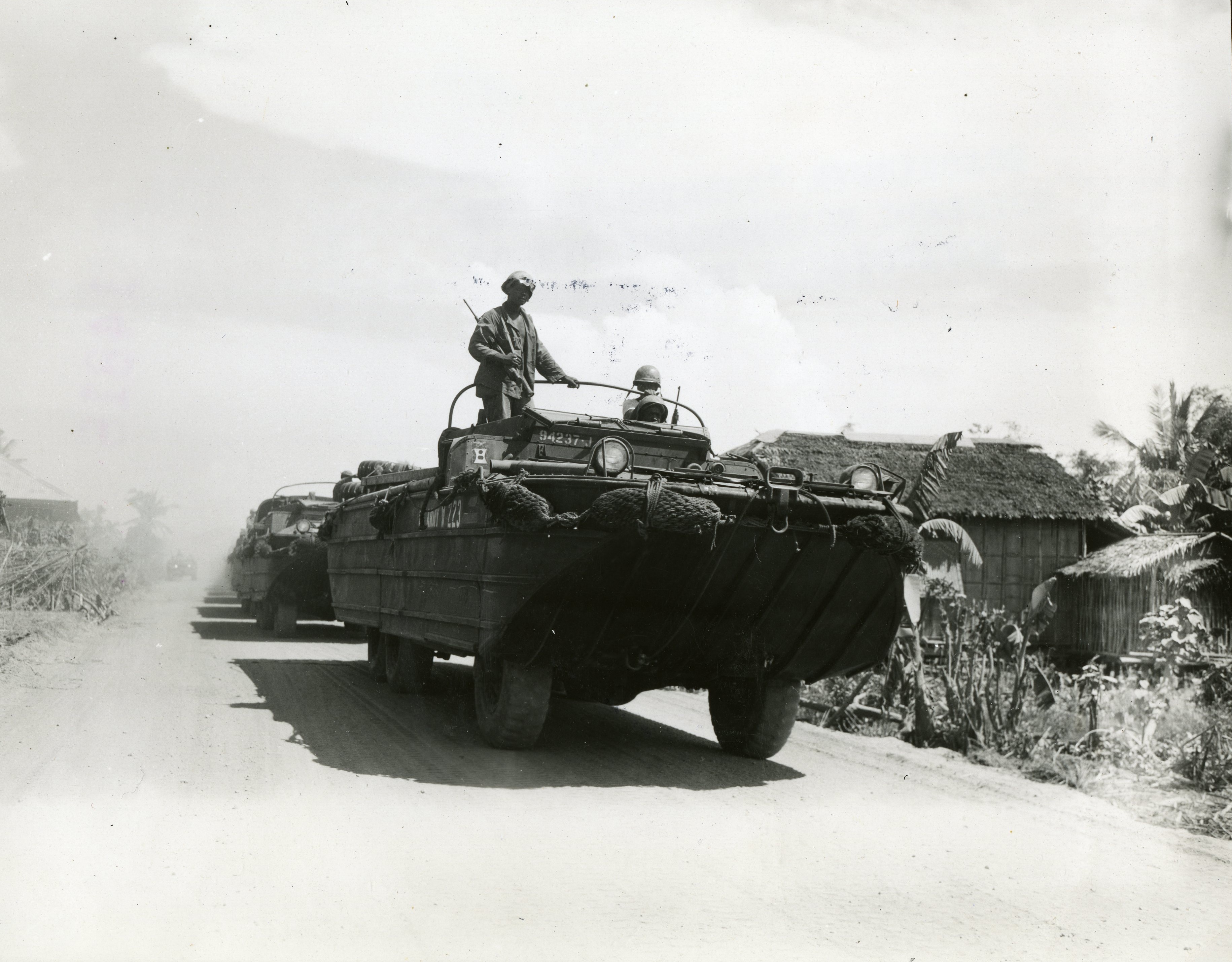 Historical image showing 828th Amphibious Truck Company of Black American soldiers during WWII